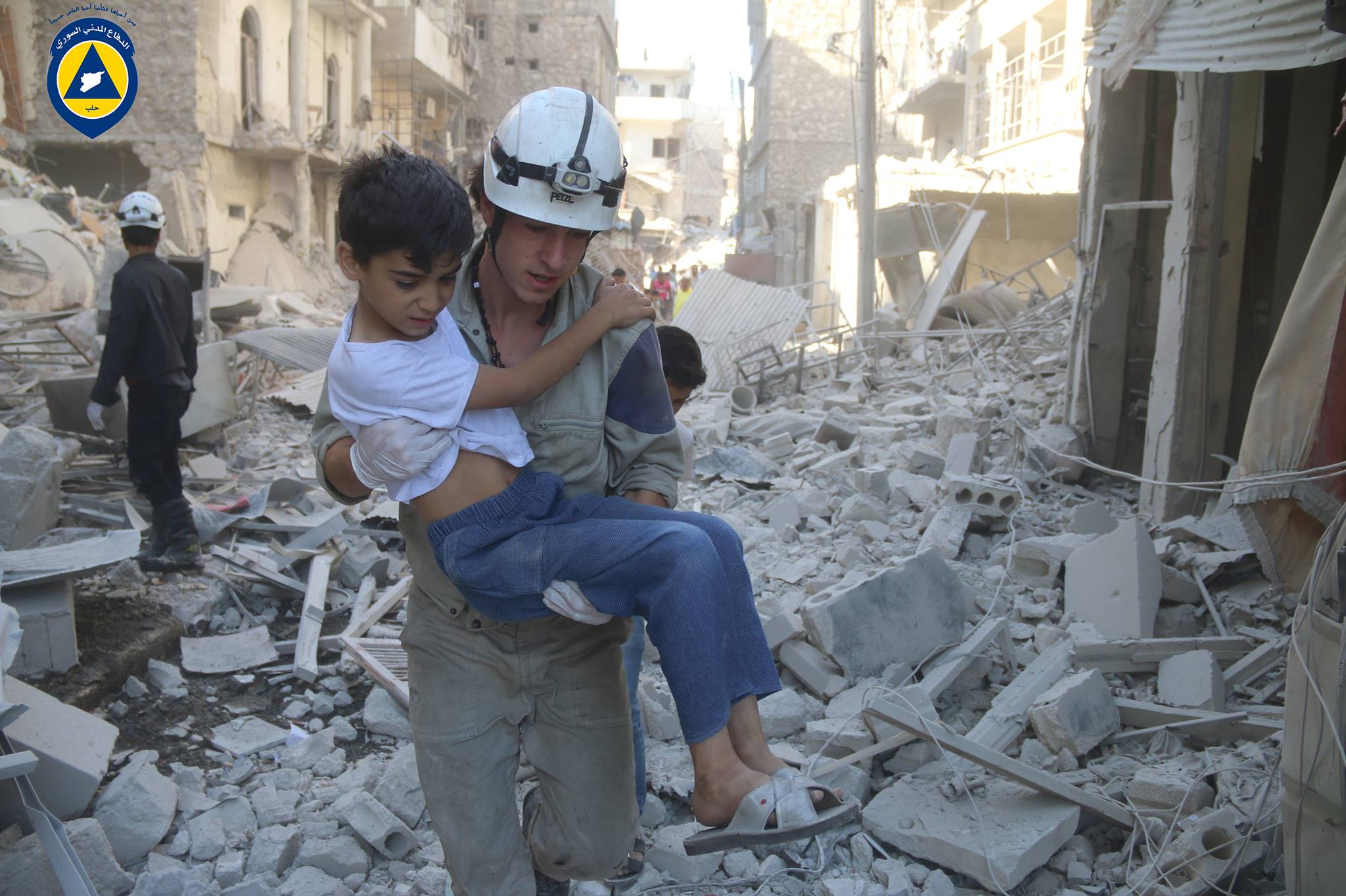 A Civil Defender in Aleppo rescues a child