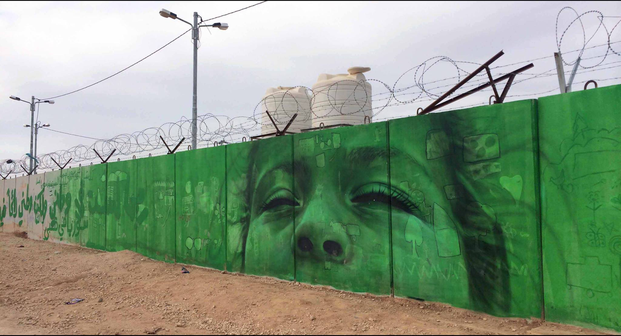 "I may not be in Syria, but Syrian is inside me. When I close my eyes I still see Syria." Mural completed in Zaatari Camp, Jordan, lead artist Jonathan Darby, photo credit Samantha Robison